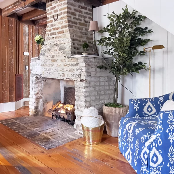 A restored original fireplace inside The Cottage at Wicklow Hall