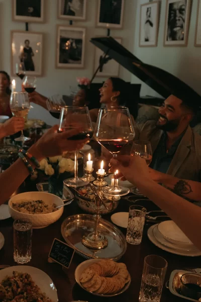 Guests clinking glasses at a rehearsal dinner at Wicklow Hall