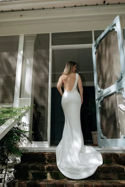 Bride showing off back of her dress on Wicklow Hall's porch