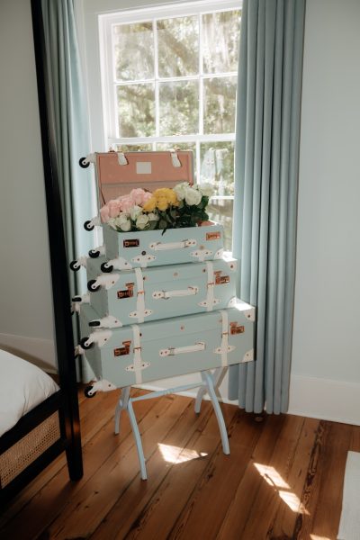 Fresh roses arranged inside vintage suitcases at Wicklow Hall